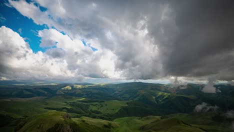 Low-clouds-over-a-highland-plateau-in-the-rays-of-sunset.-Sunset-on-Bermamyt-plateau-North-Caucasus,-Karachay-Cherkessia,-Russia.