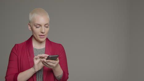 female model posing with smartphone during studio portrait 04