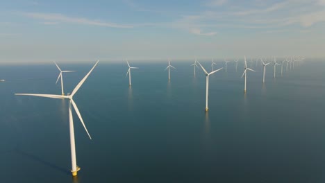 huge windmill turbines, offshore windmill farm in the ocean westermeerwind park , windmills isolated at sea on a beautiful bright day netherlands flevoland noordoostpolder