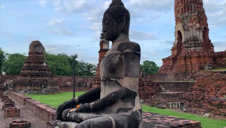 buddhist statue at temple ruins in thailand