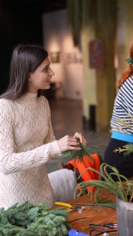 woman making a christmas wreath