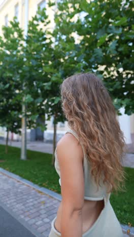 woman walking in a city park