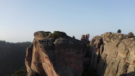 Straffe-drone-shot-panning-slowly-form-left-to-right-showing-the-other-sides-of-the-Belogradchik-natural-rock-formations,-in-the-province-of-Vidin-in-Northwestern-Bulgaria