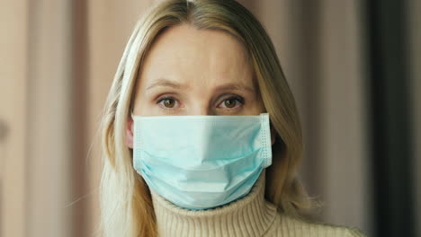 Portrait-of-a-sad-woman-in-bandage-in-quarantine-1