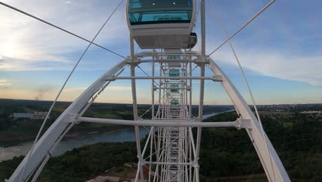 ferris wheel in foz do iguaçu, brazil at sunset.