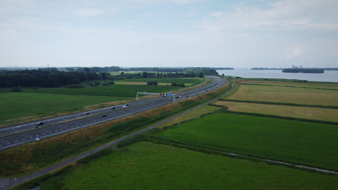 Aerial shot of motorway in the Netherlands, rising.