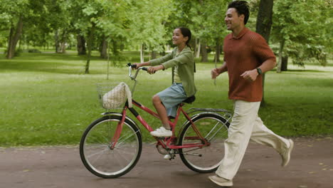 people riding bike in park