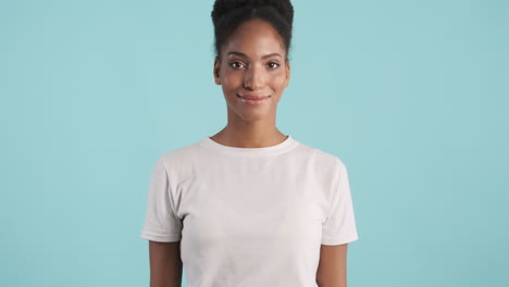 young woman smiling slightly and posing