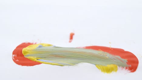 Paint-brush-falling-on-white-background-4k