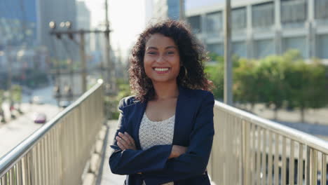 smiling businesswoman on city overpass