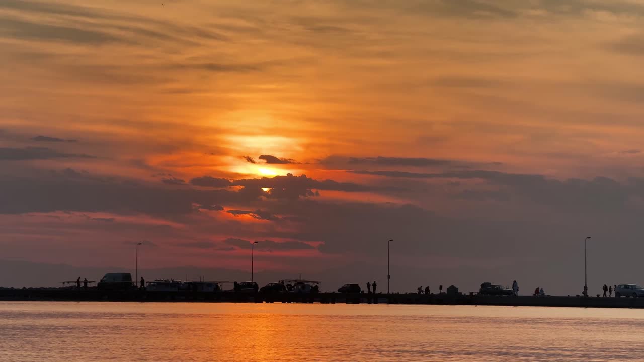 Sunset gold hour beautiful sun set big orange skyline ocean sea reflection