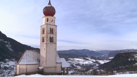 an eastern church in a snowbound tyrolean village in the alps in austria switzerland italy slovenia or an eastern european country 2