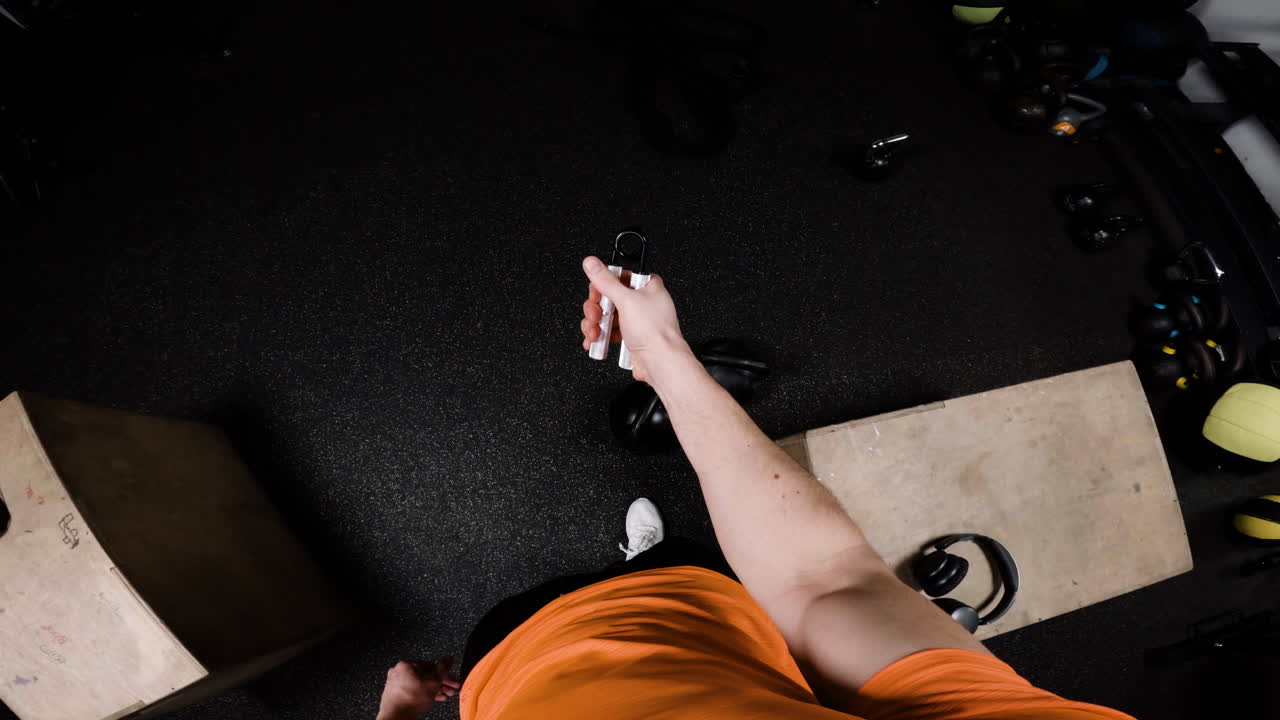 Man using hand grips in gym