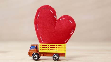 Red-heart-being-carried-by-truck