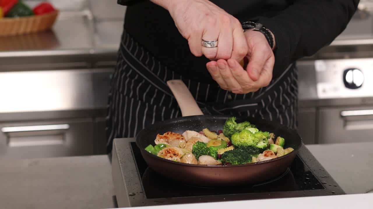 Chef Preparing a Lemon Herb Chicken and Vegetable Dish