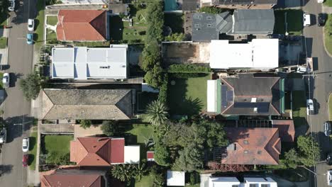 top down view on residential area comprising of modern australian houses surrounding a woodland beachfront area in maroubra on an autumn sunny day