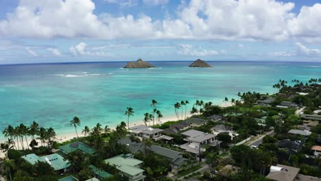 Drone-shot-pushing-towards-two-small-islands-off-the-shore-of-Oahu