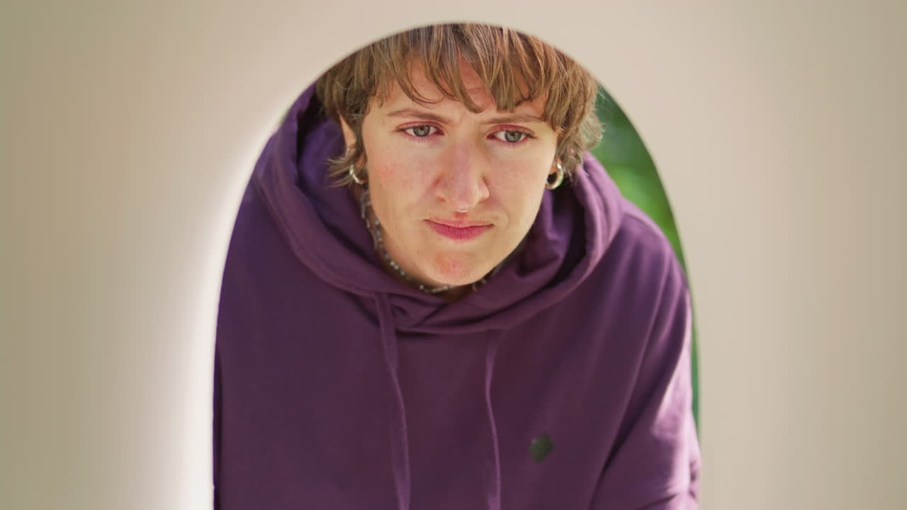 Disappointed Woman Checking Empty Mailbox on Sunny Day