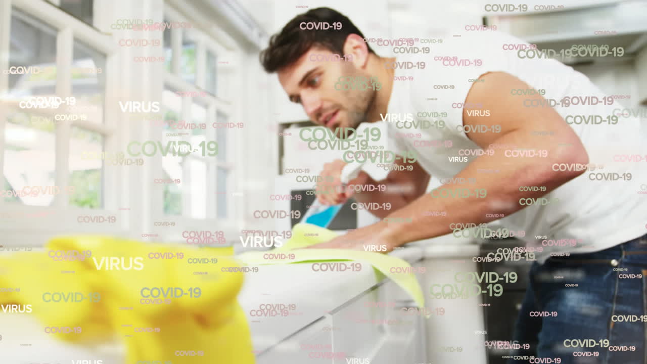 Covid-19 and virus text against man cleaning and using sprinkler