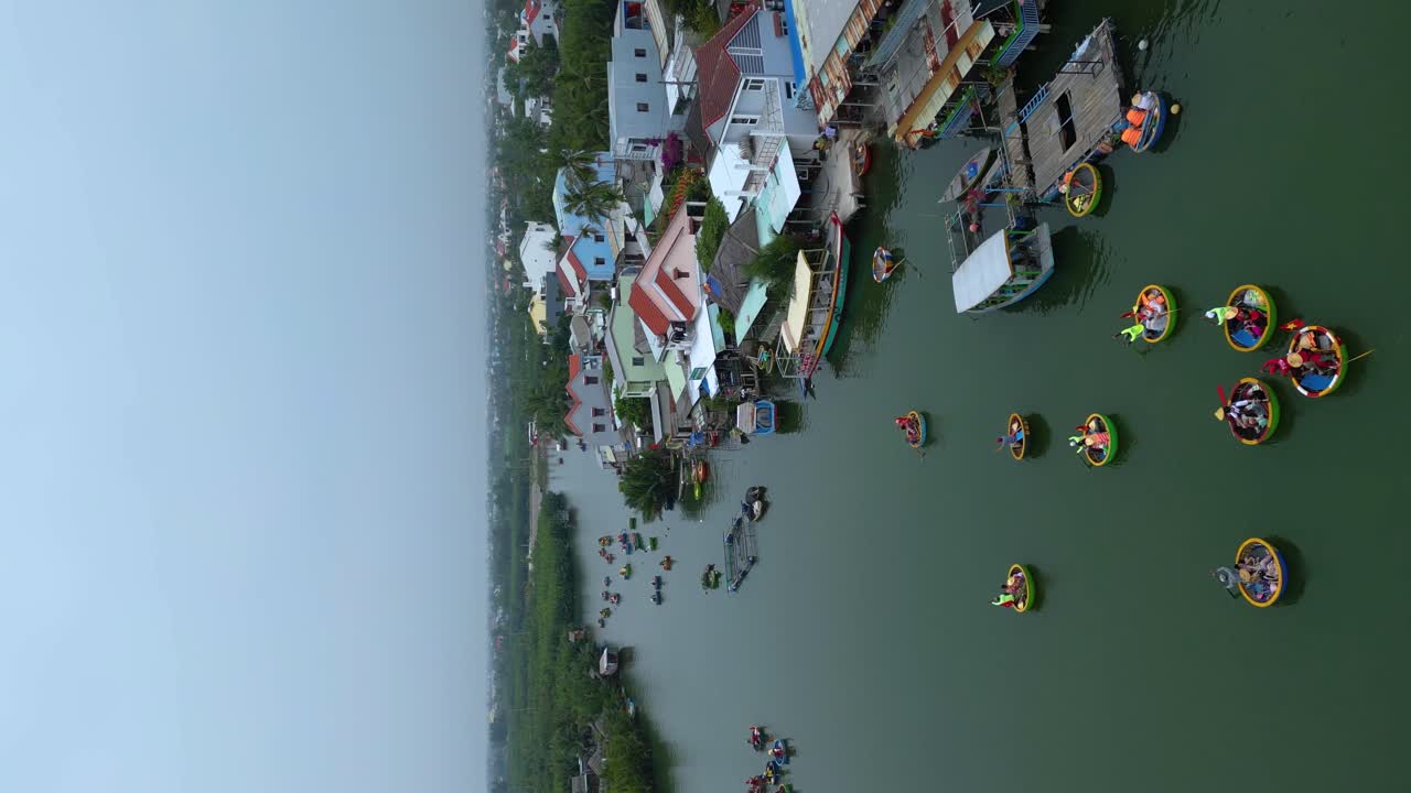 Hoi An Thu Bon River Coconut Forest basket boat river Vietnam, aerial vertical video