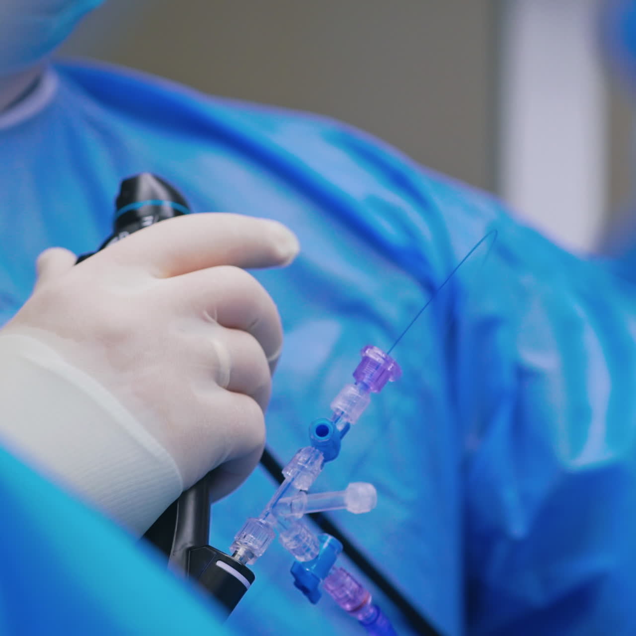 Doctor uses special instrument during operation. Surgeon monitoring patient with new equipment in the operating room. Close-up.
