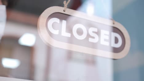 small business opening up. turning the sign from close to open. 4k 60fps
