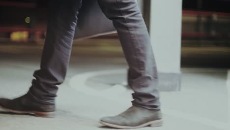 businessman is walking on multi-storey car park after his work - 1