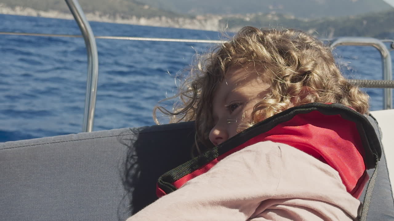 small girl enjoying a yacht in greece