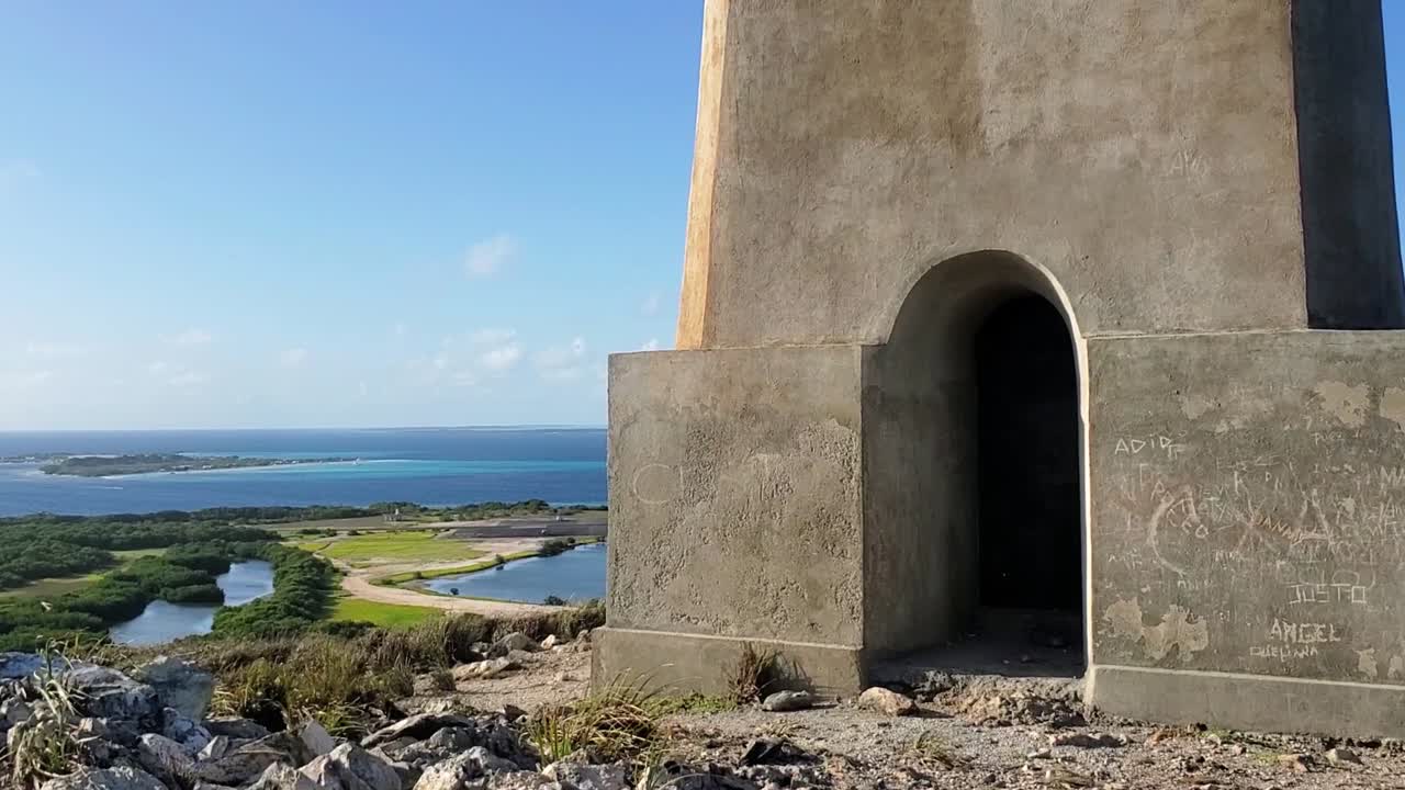 Experience a breathtaking tilt-up shot of Faro Los Roques lighthouse on the beautiful Los Roques Archipelago