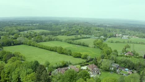 aerial view over green patchwork farmland countryside pasture landscape