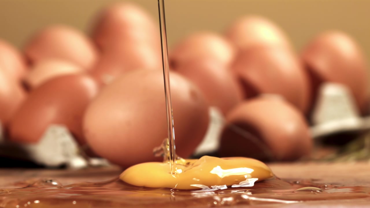 Slow Motion of a Raw Egg Yolk and White Separating