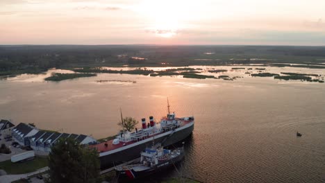 ss city of milwaukee ghost ship docked in manistee, michigan with drone video moving out