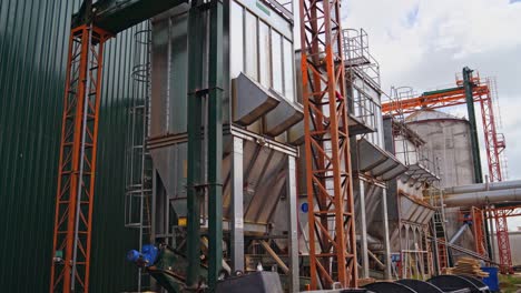 big modernized factory outdoors. woodworking plant. modern metal construction of industrial plant outside.