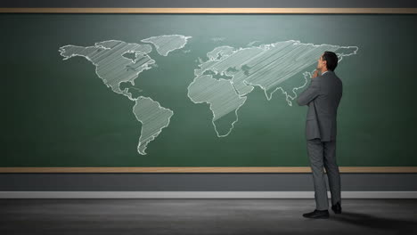 businessman looking at world map