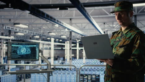 soldier in server hub using laptop to deploy ai tech, modernizing defense
