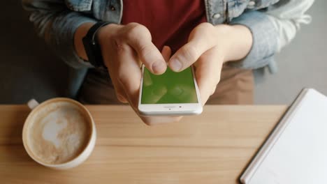 man using smart phone with green screen