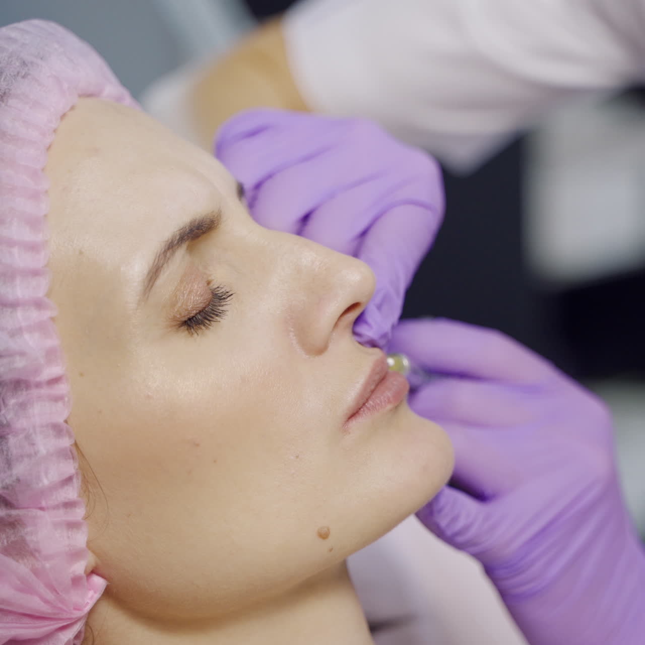 Lip Augmentation. Woman Getting Beauty Injection For Lips