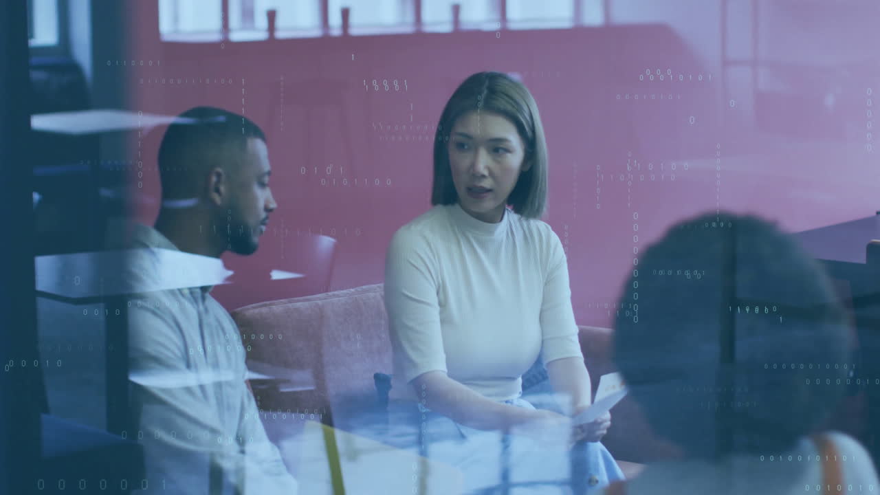 Animation of data processing and shapes over diverse colleagues discussing work