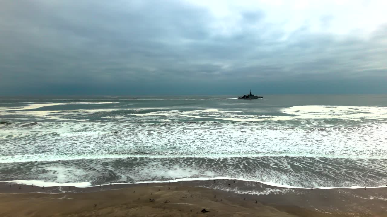 Huayquique beach Chile Iquique building ocean sea traffic tarapaca mountain ocean sea foam boat ship side drone travelling