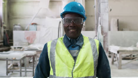 man wearing protective gear in factory