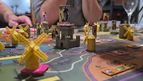 fief board game - players taking the components of the game board