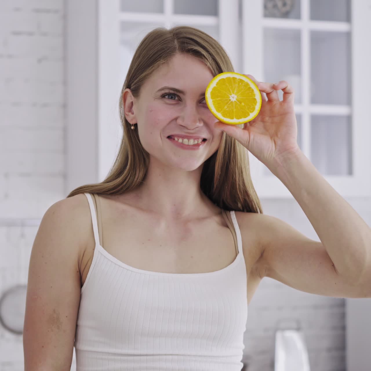 Woman cutting fruit in the kitchen