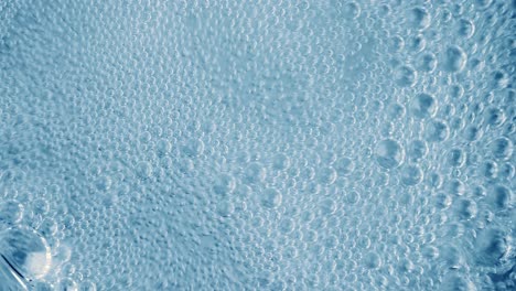 oxygen bubbles in water on a blue abstract background