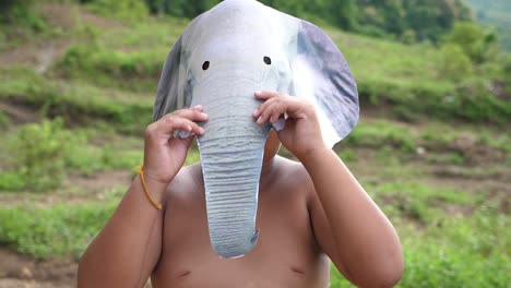 Asian Boy Wearing Elephant Mask