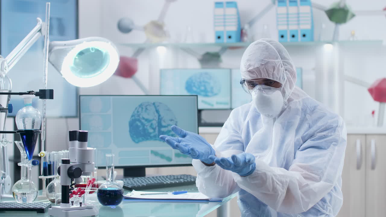 Scientist in Protective Suit Conducting Medical Research