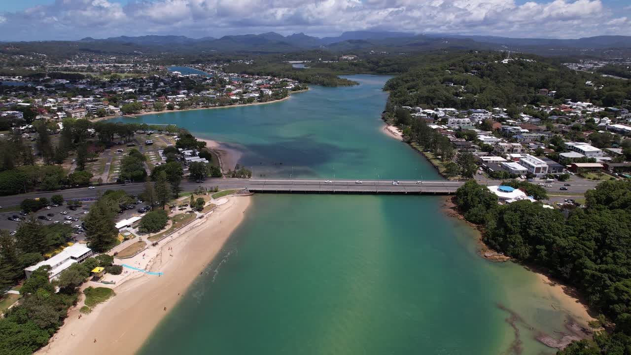 Cars Driving Through Tallebudgera Creek Bridge In Burleigh Heads, Australia. - aerial shot
