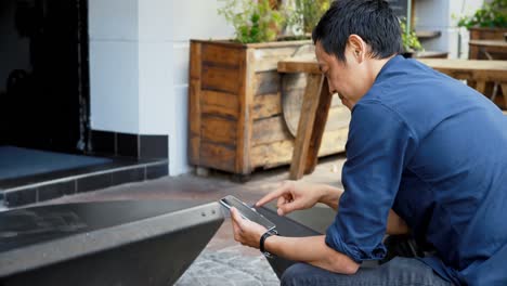 man using mobile phone at outdoor cafe 4k