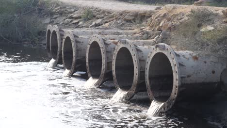 Polluted-water-bio-hazard-dumping-in-river-near-Karachi,-Pakistan