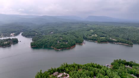 aerial-push-in-lake-james-nc-with-table-rock-mountain-in-background