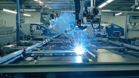 robot arm welding in a factory